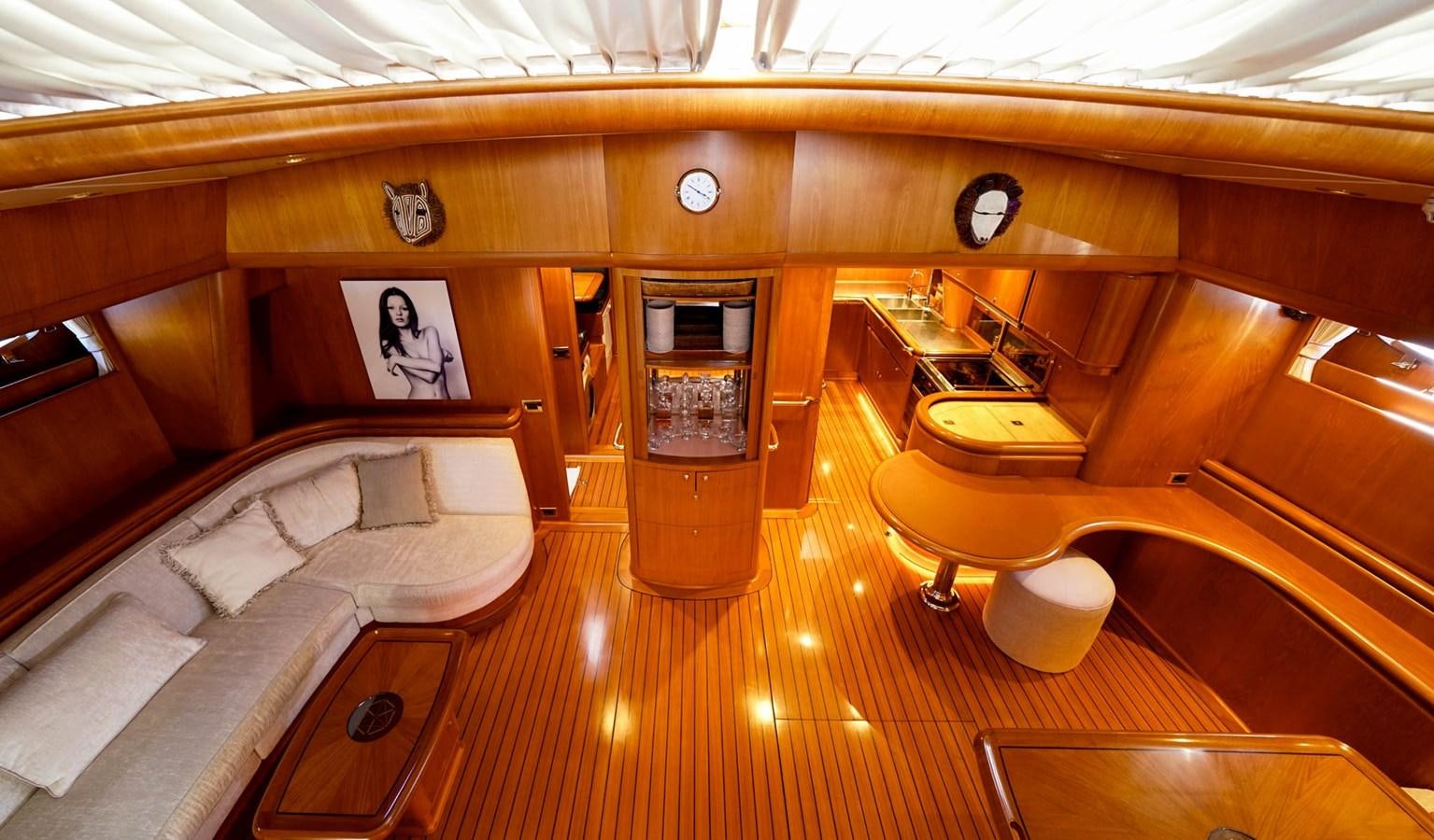 a room with a couch and a television aboard IKARON Yacht for Sale