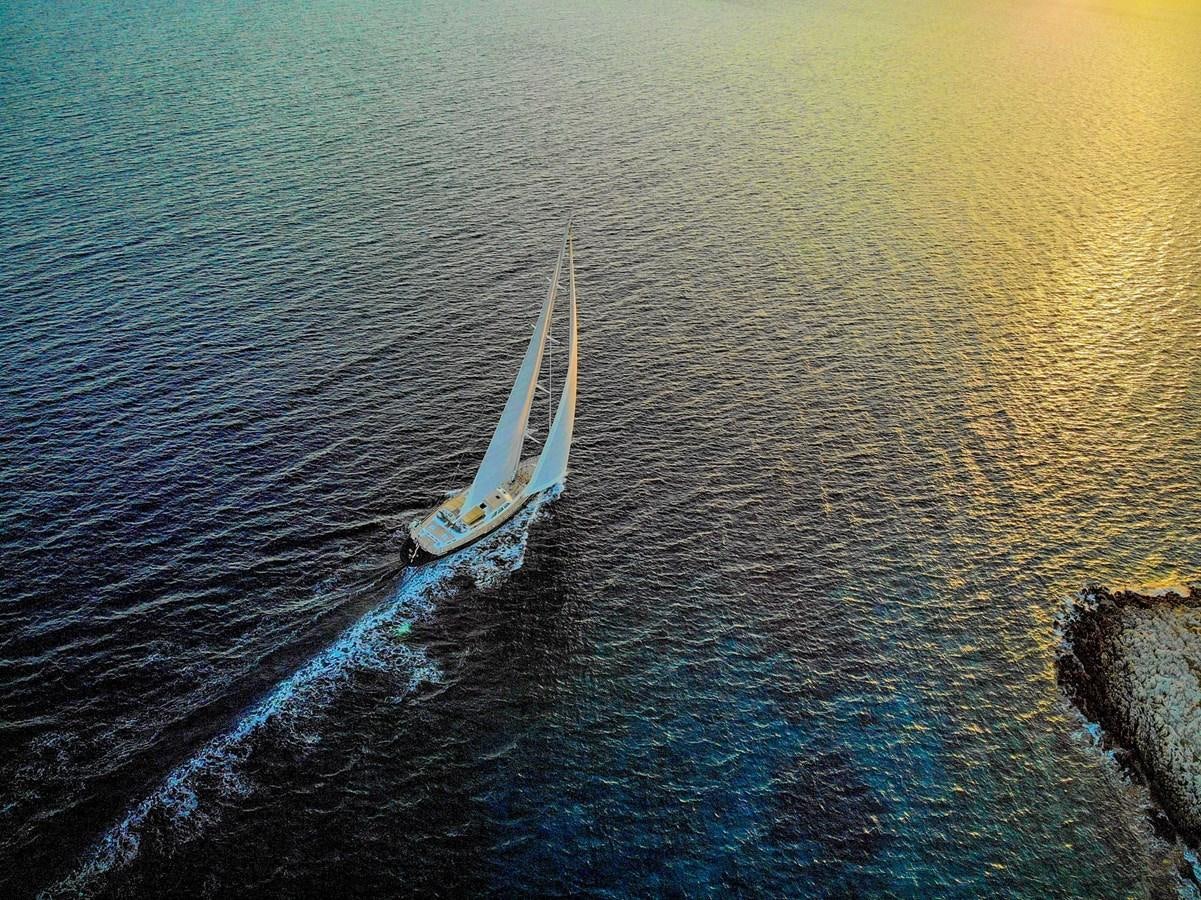 a boat sailing on the sea aboard IKARON Yacht for Sale