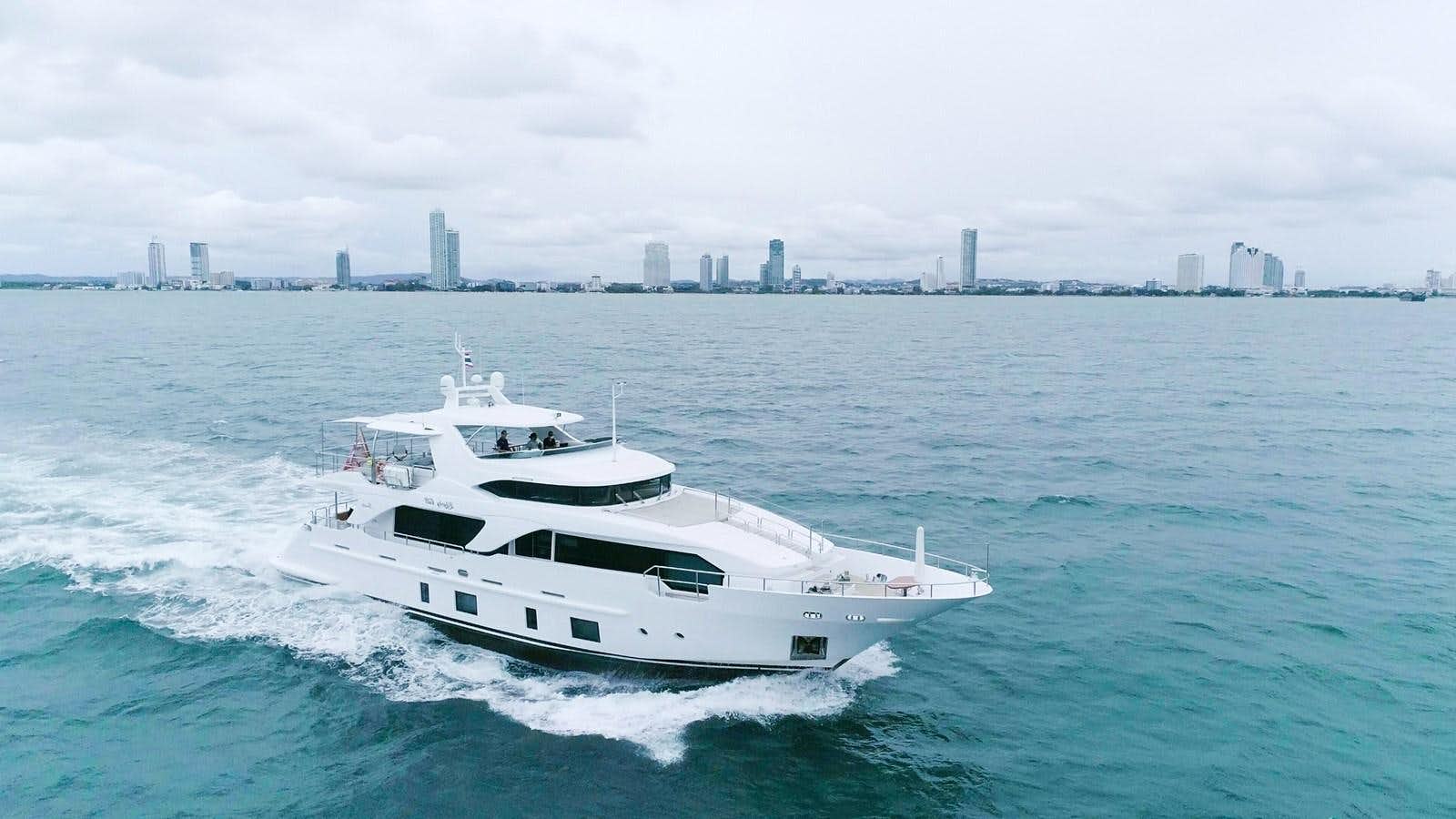a white yacht on the water aboard LIBERTY CALL Yacht for Sale