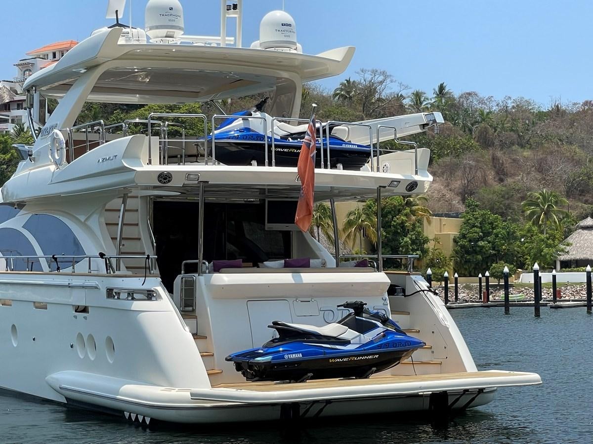 a boat docked at a pier aboard 2008 AZIMUT 75 FLY @ IXTAPA ZIHUATANEJO Yacht for Sale