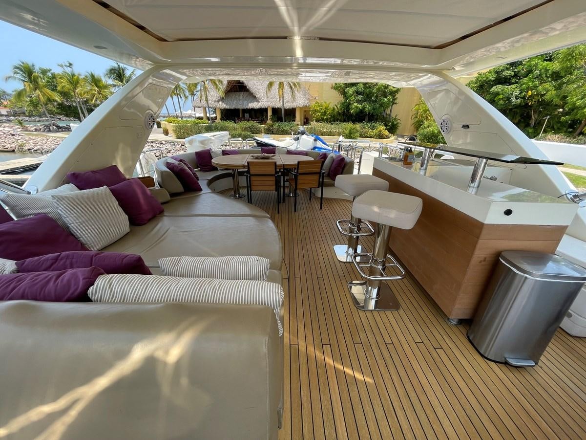 a room with a table and chairs aboard 2008 AZIMUT 75 FLY @ IXTAPA ZIHUATANEJO Yacht for Sale