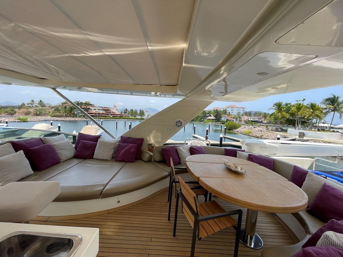 a room with a table and chairs aboard 2008 AZIMUT 75 FLY @ IXTAPA ZIHUATANEJO Yacht for Sale