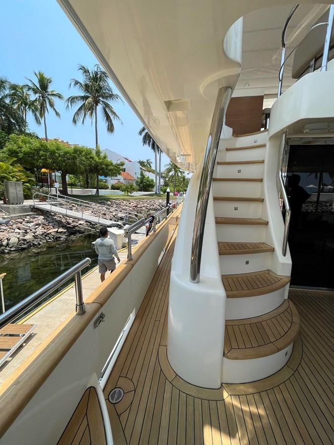 a person standing on a balcony aboard 2008 AZIMUT 75 FLY @ IXTAPA ZIHUATANEJO Yacht for Sale