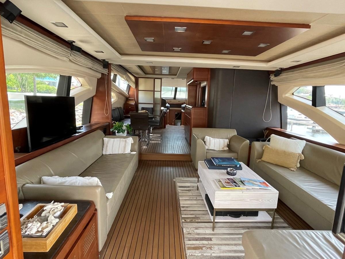 a living room with a large wood floor aboard 2008 AZIMUT 75 FLY @ IXTAPA ZIHUATANEJO Yacht for Sale