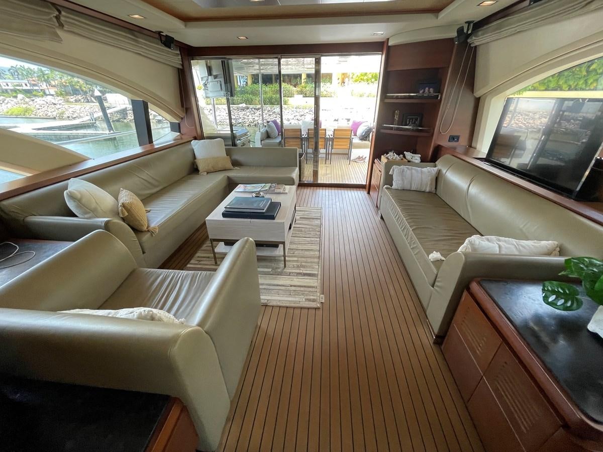 a living room with a wood floor aboard 2008 AZIMUT 75 FLY @ IXTAPA ZIHUATANEJO Yacht for Sale