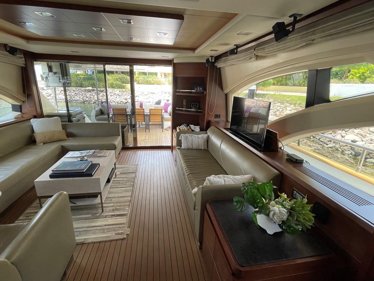 a living room with a large window aboard 2008 AZIMUT 75 FLY @ IXTAPA ZIHUATANEJO Yacht for Sale