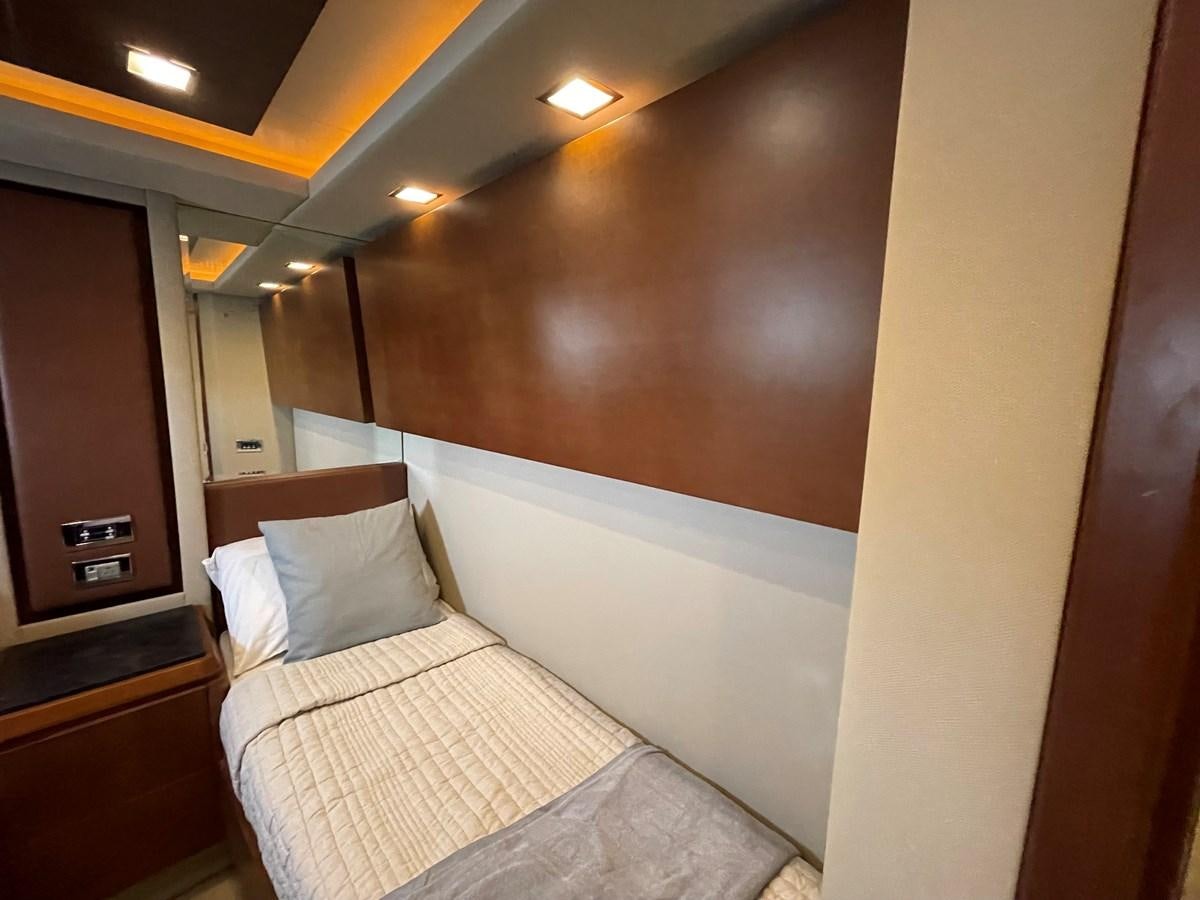 a bed with a white comforter aboard 2008 AZIMUT 75 FLY @ IXTAPA ZIHUATANEJO Yacht for Sale
