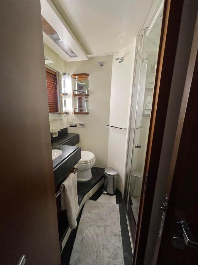 a bathroom with a toilet and sink aboard 2008 AZIMUT 75 FLY @ IXTAPA ZIHUATANEJO Yacht for Sale