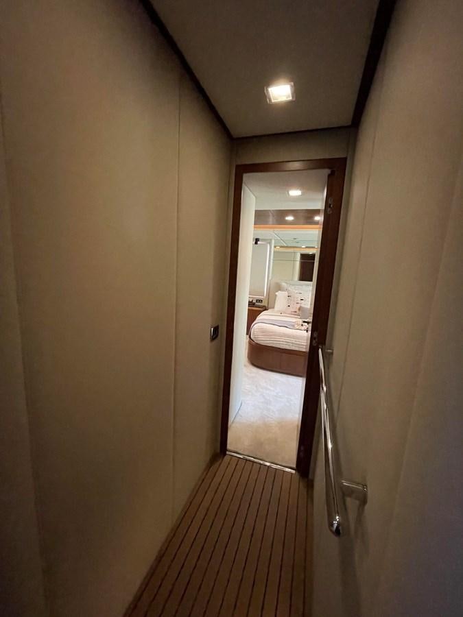 a hallway with a door and a mirror aboard 2008 AZIMUT 75 FLY @ IXTAPA ZIHUATANEJO Yacht for Sale