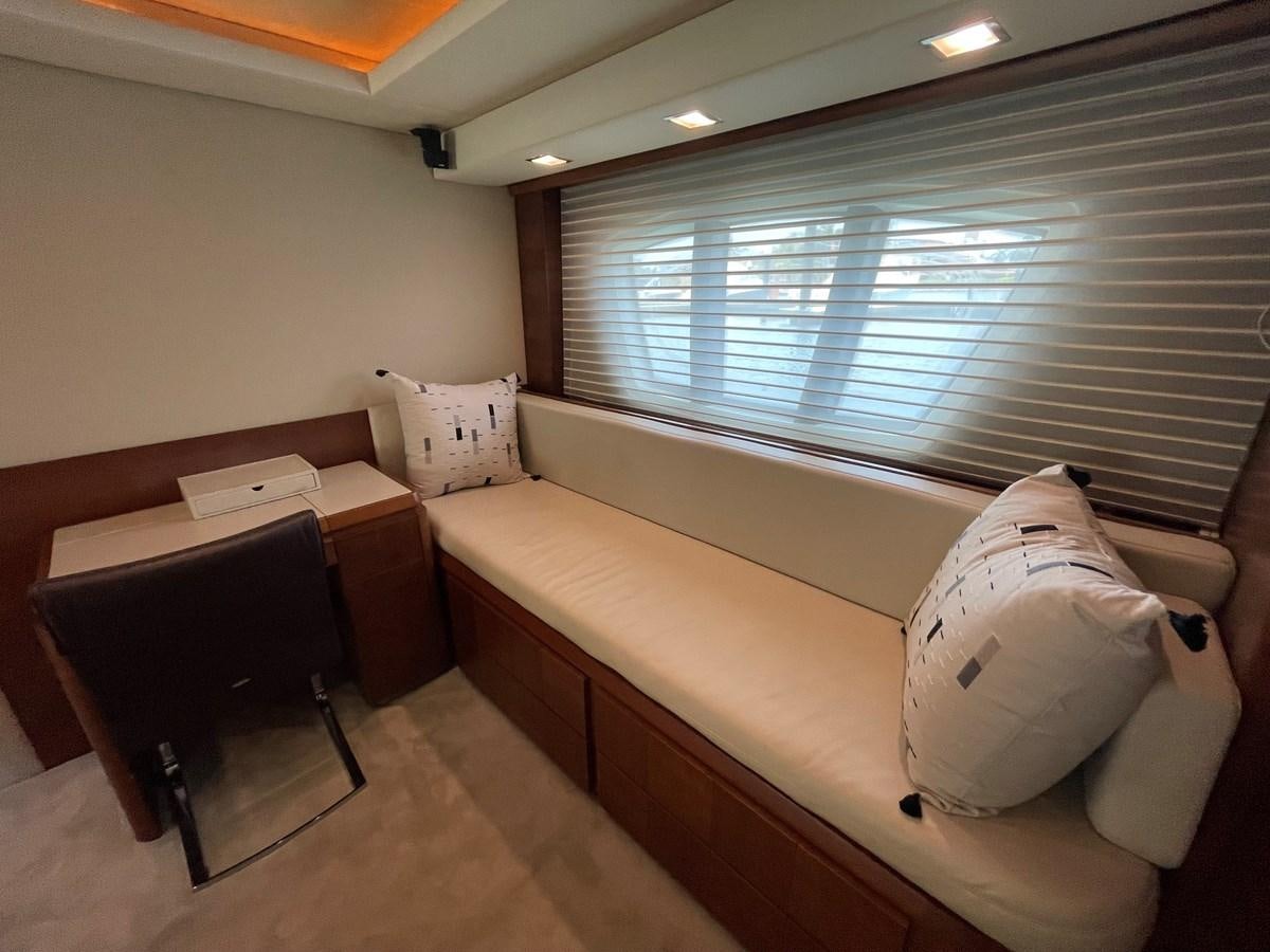 a bed and a desk in a room aboard 2008 AZIMUT 75 FLY @ IXTAPA ZIHUATANEJO Yacht for Sale
