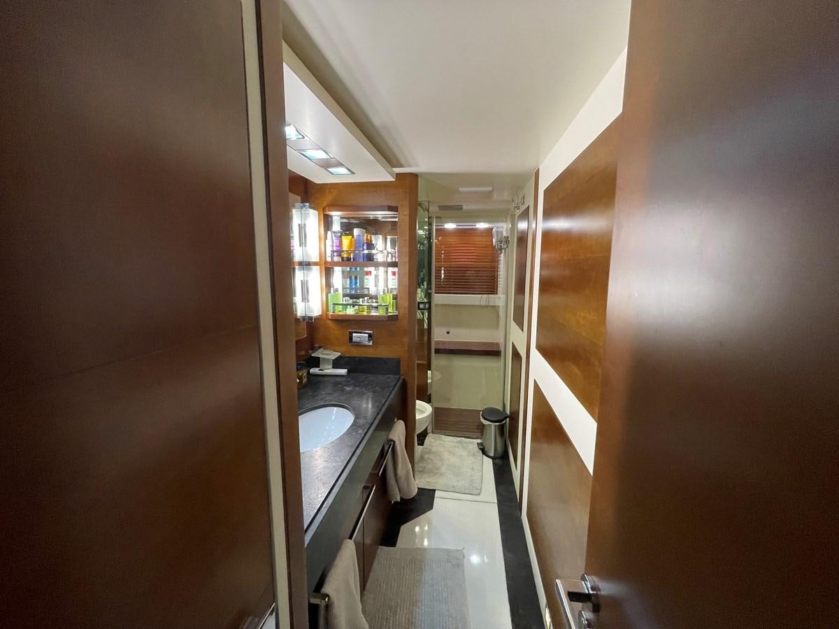 a bathroom with a sink and a mirror aboard 2008 AZIMUT 75 FLY @ IXTAPA ZIHUATANEJO Yacht for Sale
