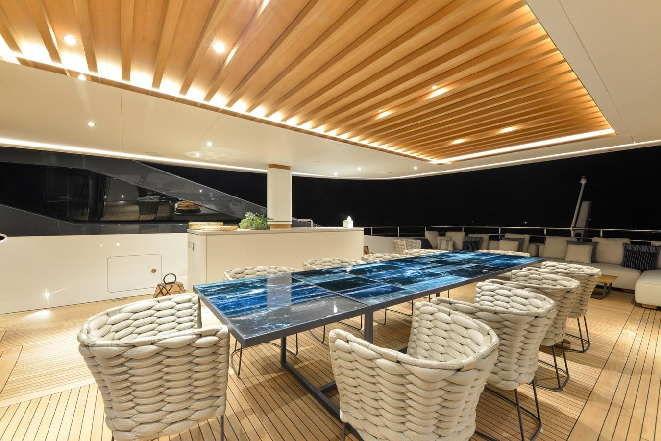 a room with a table and chairs aboard MINE GAMES Yacht for Sale