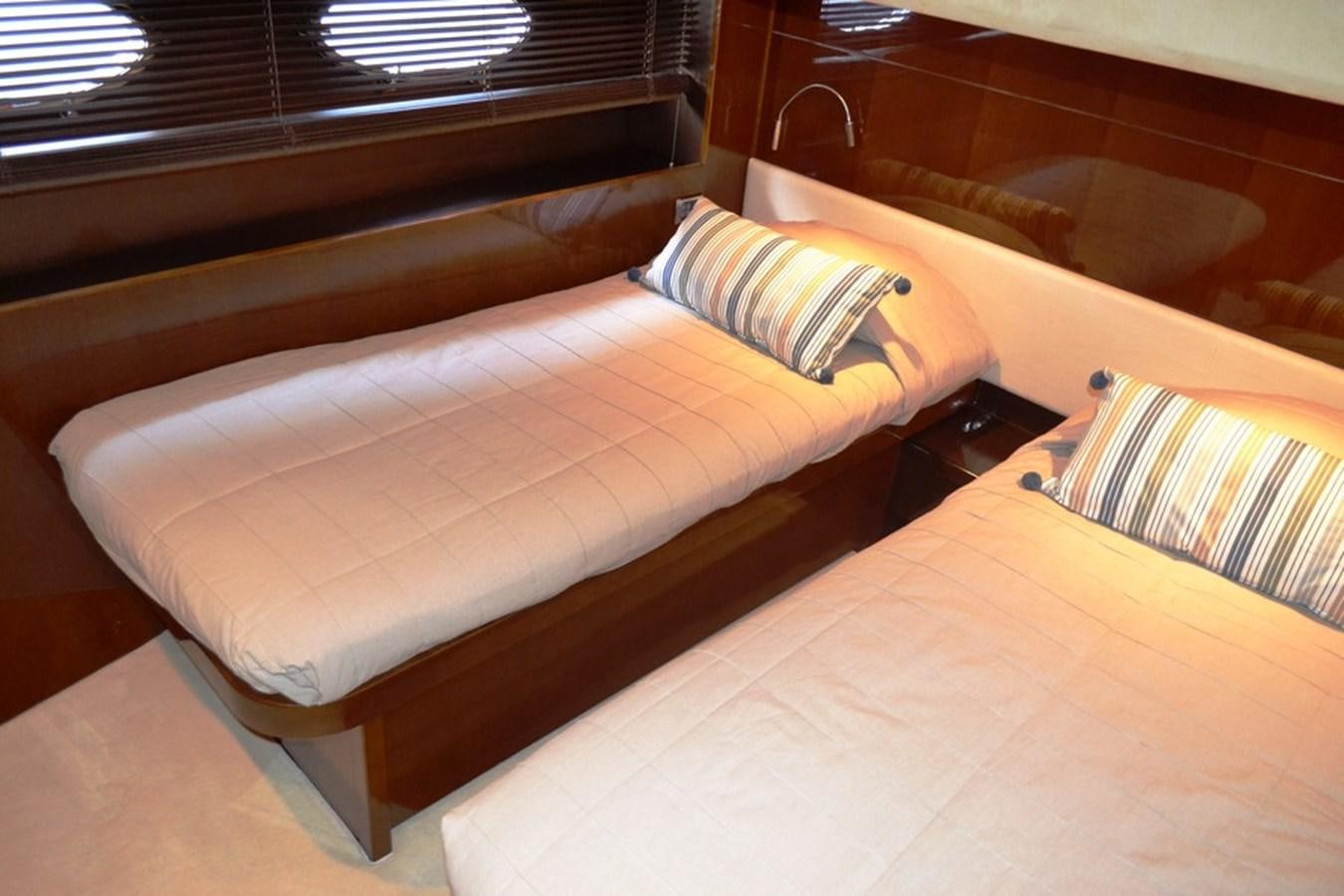 a bed with a pillow aboard WATCHIT Yacht for Sale