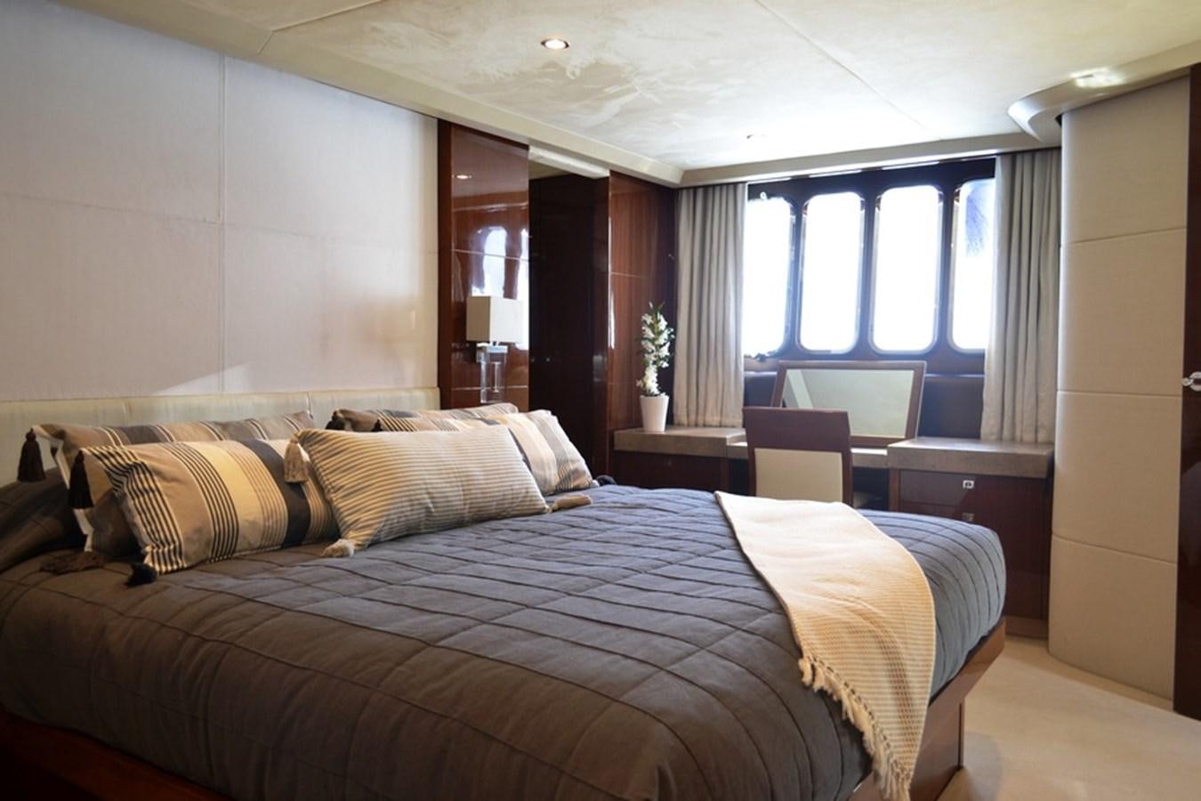 a large bed in a room aboard WATCHIT Yacht for Sale