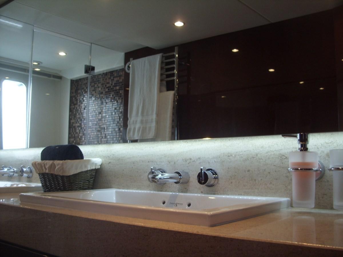 a bathroom with a large mirror aboard WATCHIT Yacht for Sale
