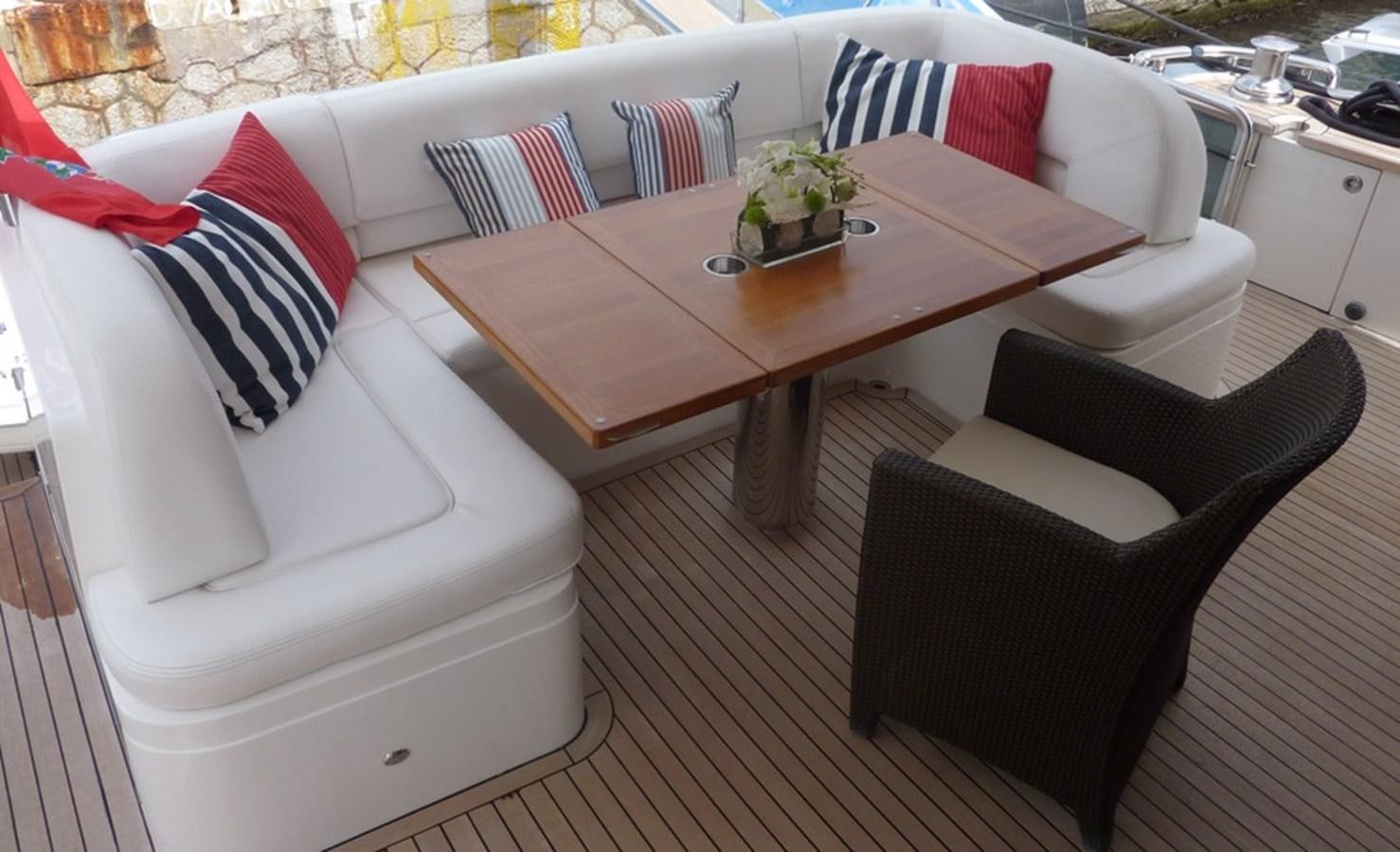 a couch and a table aboard WATCHIT Yacht for Sale
