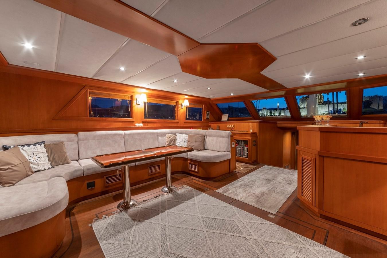 a living room with a couch and a table aboard ARABELLA Yacht for Sale