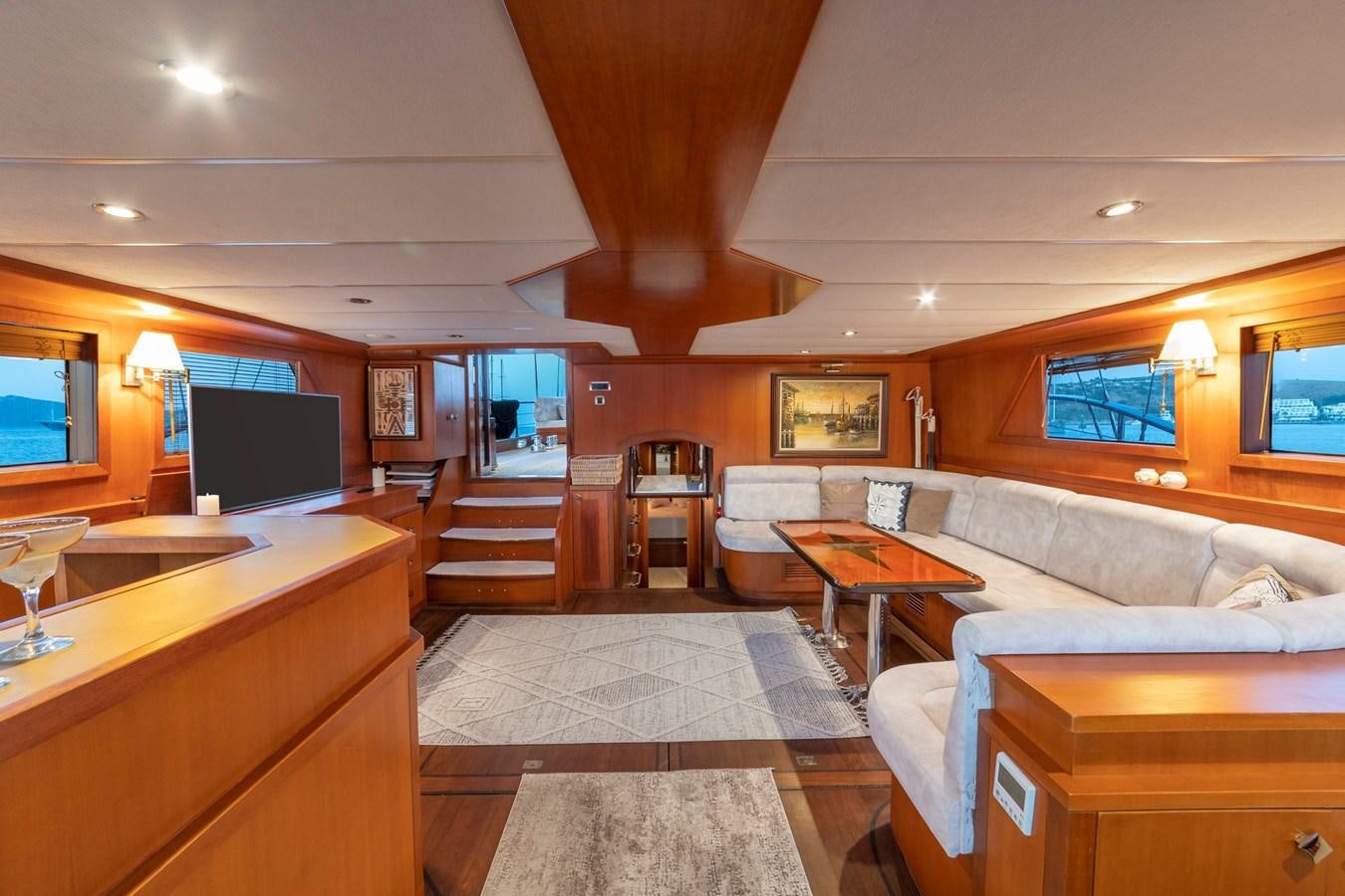 a living room with a large window aboard ARABELLA Yacht for Sale