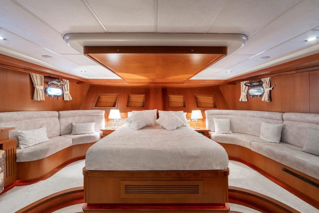 a room with a bed and a couch aboard ARABELLA Yacht for Sale