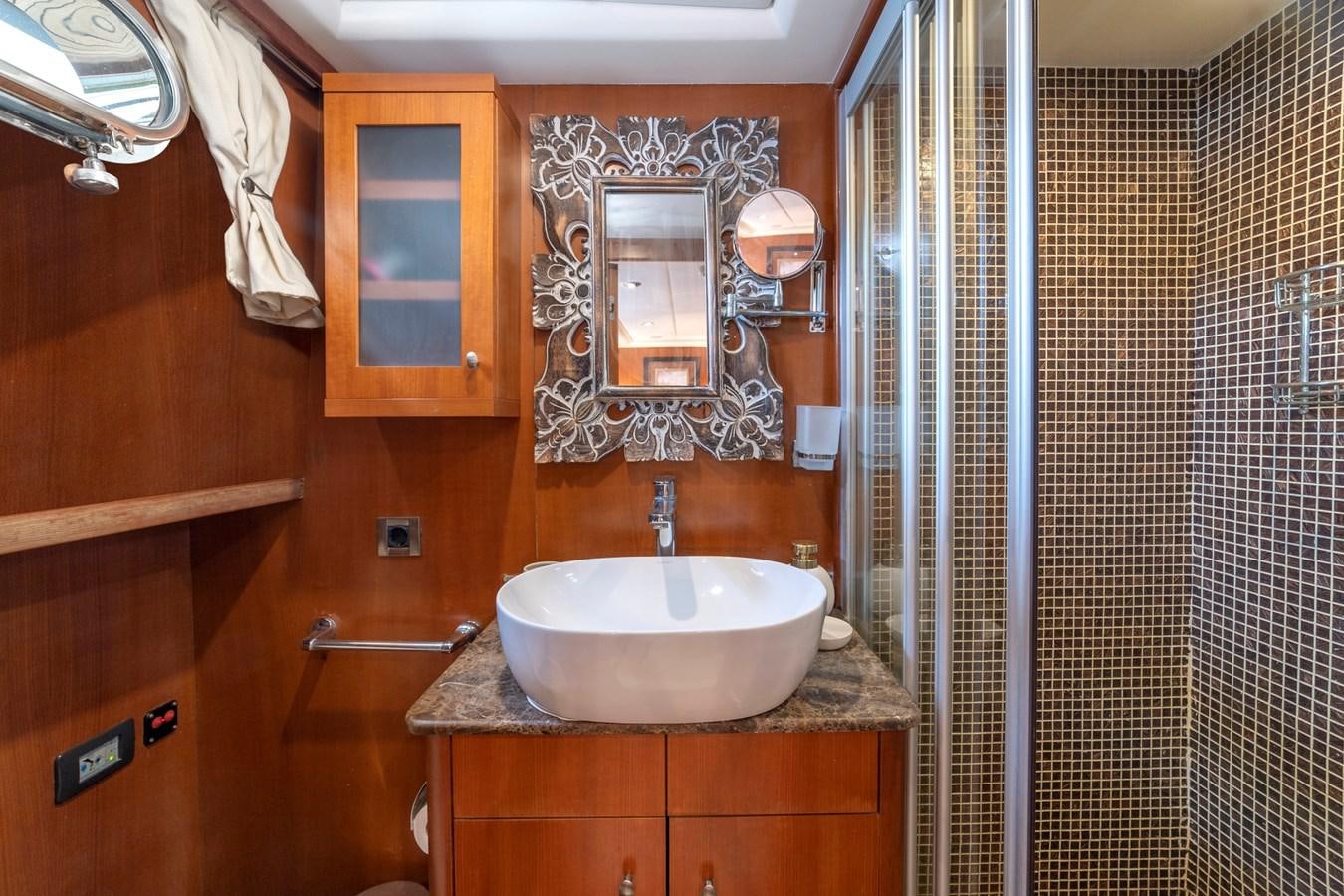 a bathroom with a sink and a mirror aboard ARABELLA Yacht for Sale