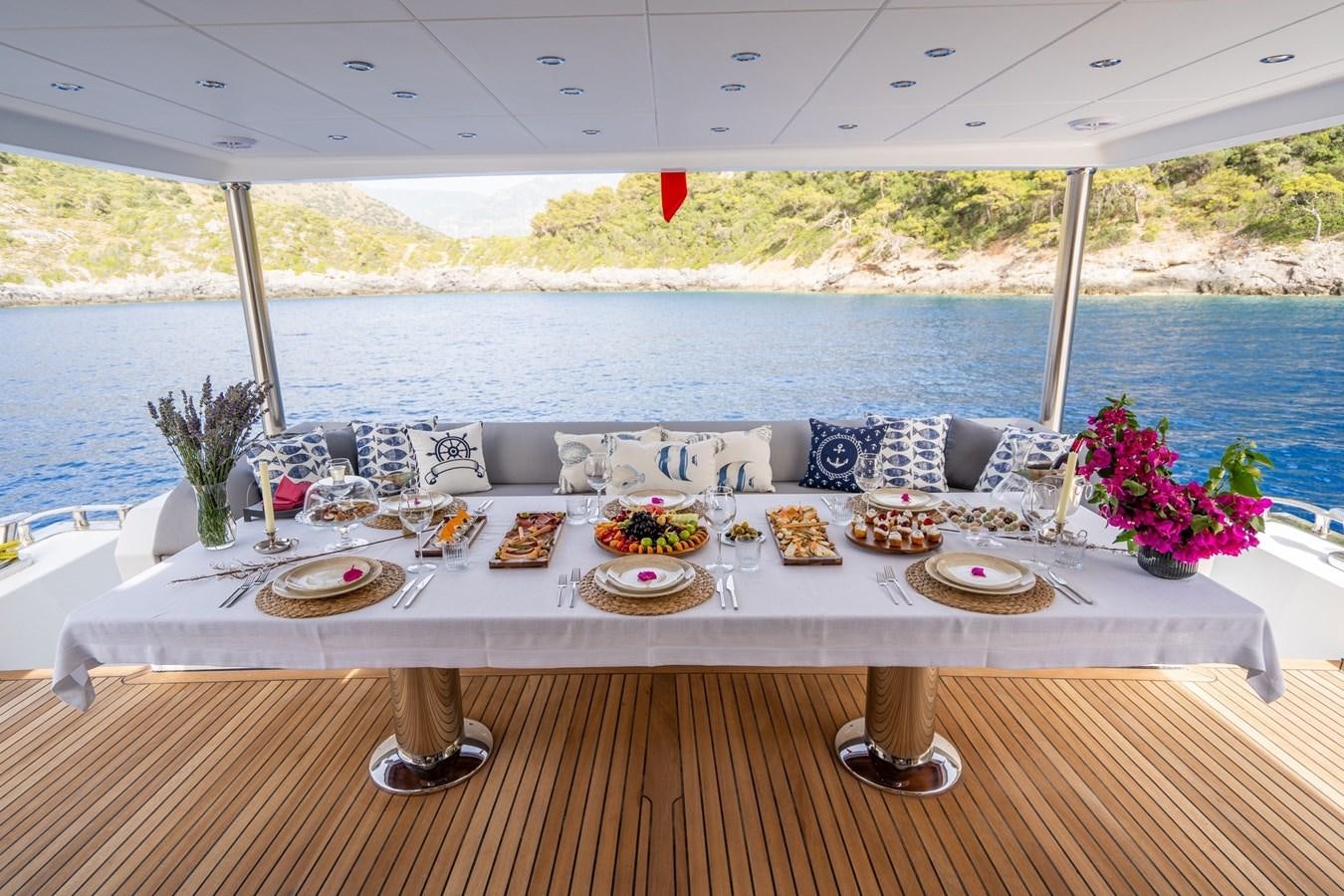 a table set for a dinner aboard LAVIN Yacht for Sale