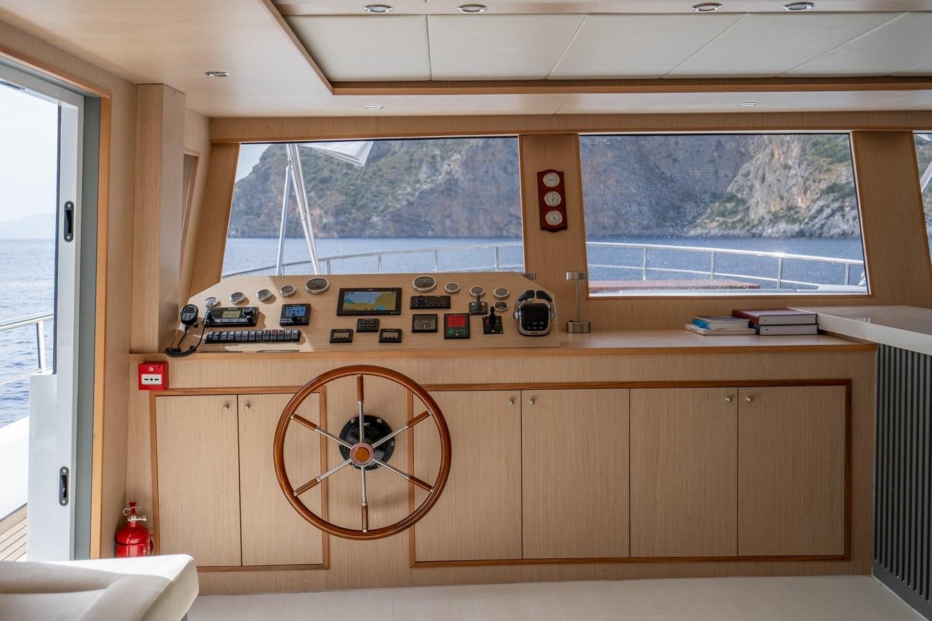 a wooden room with a large wooden wall and a large fan aboard LAVIN Yacht for Sale