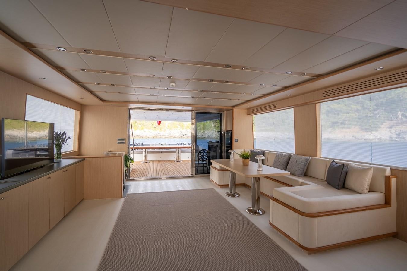 a living room with a large window aboard LAVIN Yacht for Sale