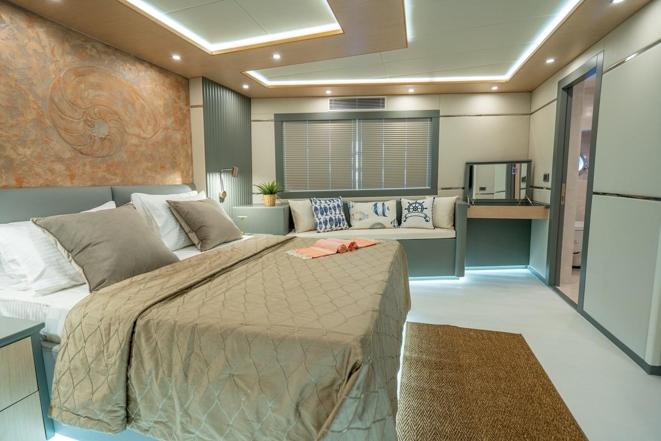 a large bedroom with a large bed aboard LAVIN Yacht for Sale