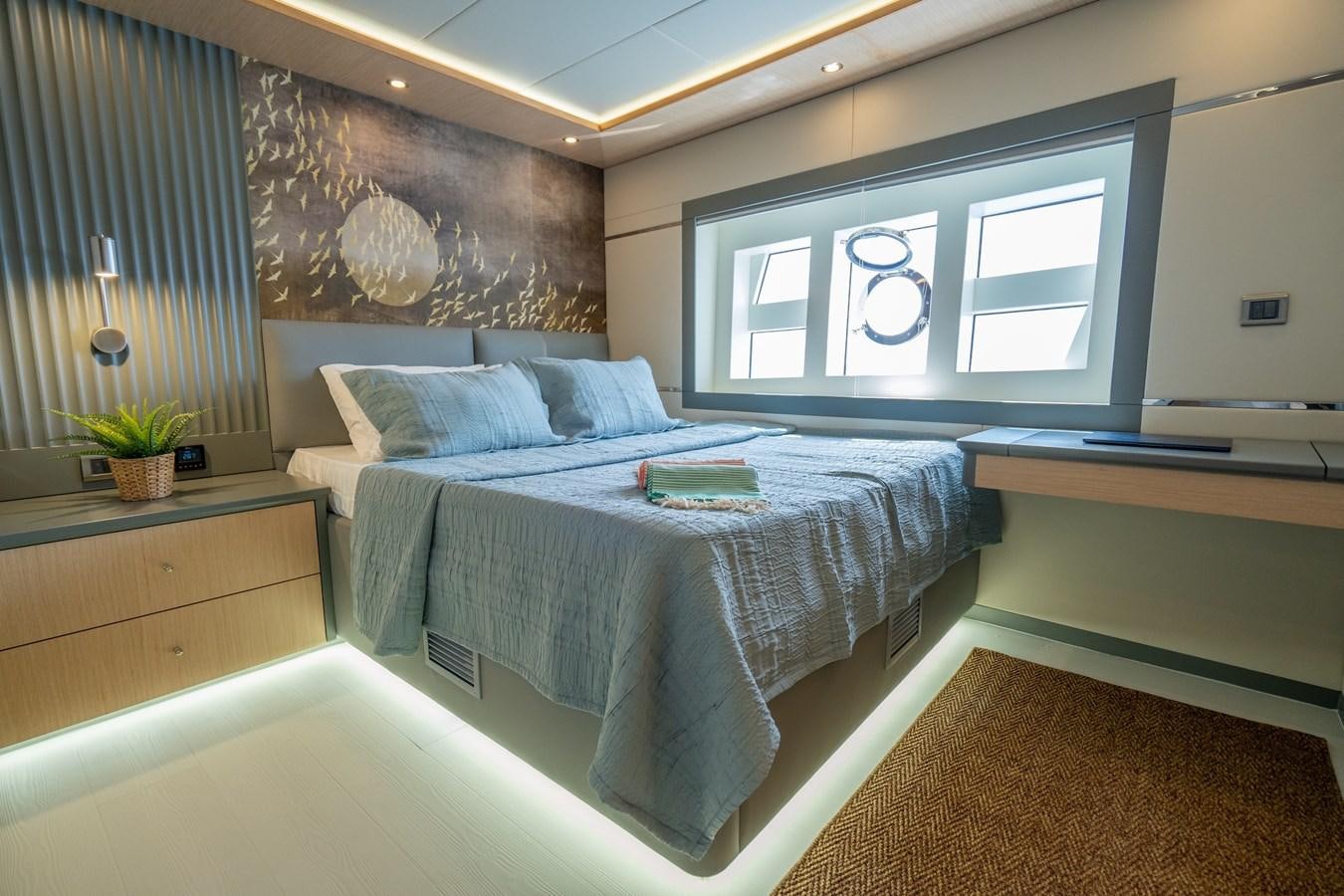 a bed with a white sheet aboard LAVIN Yacht for Sale