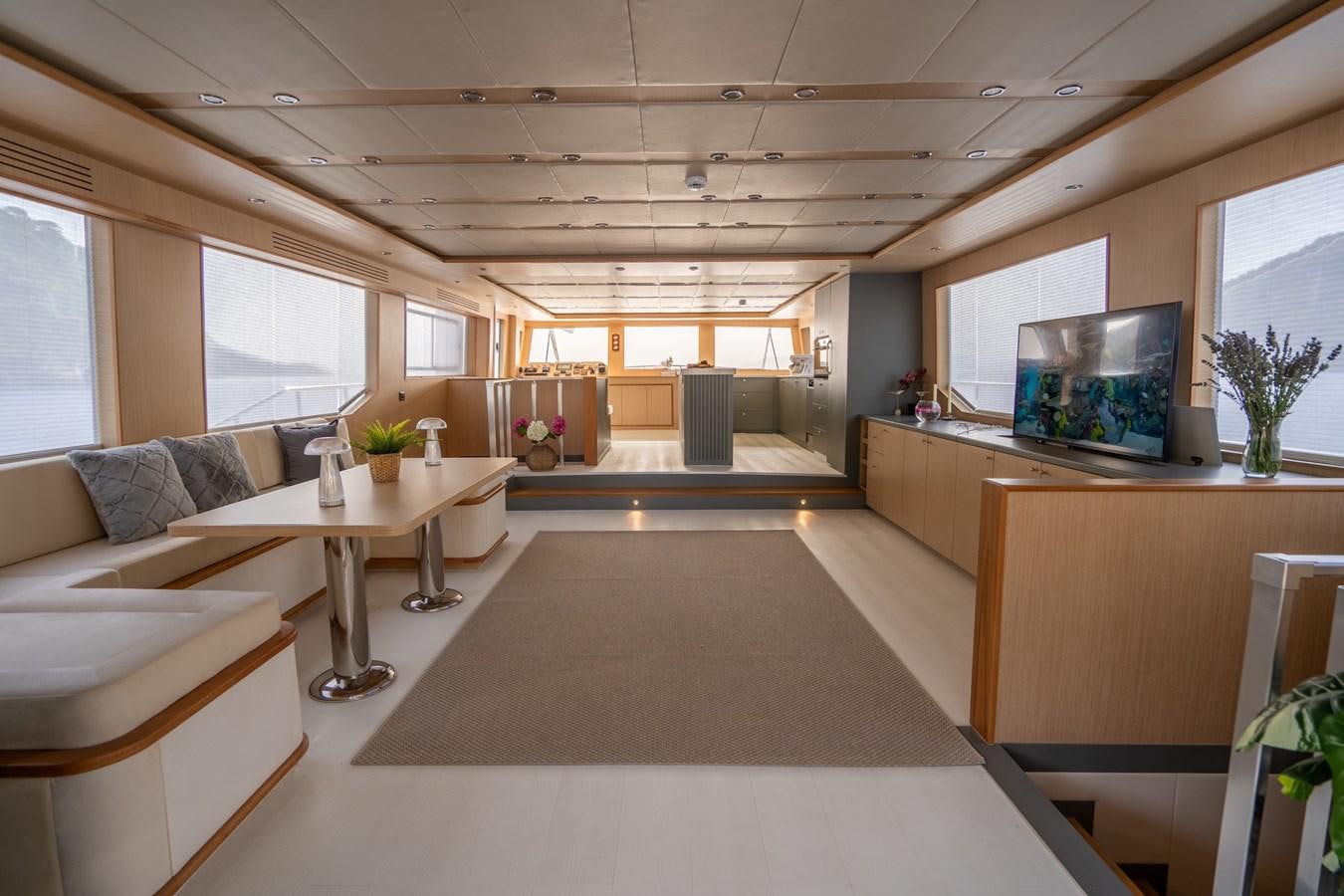 a room with a couch and a tv aboard LAVIN Yacht for Sale