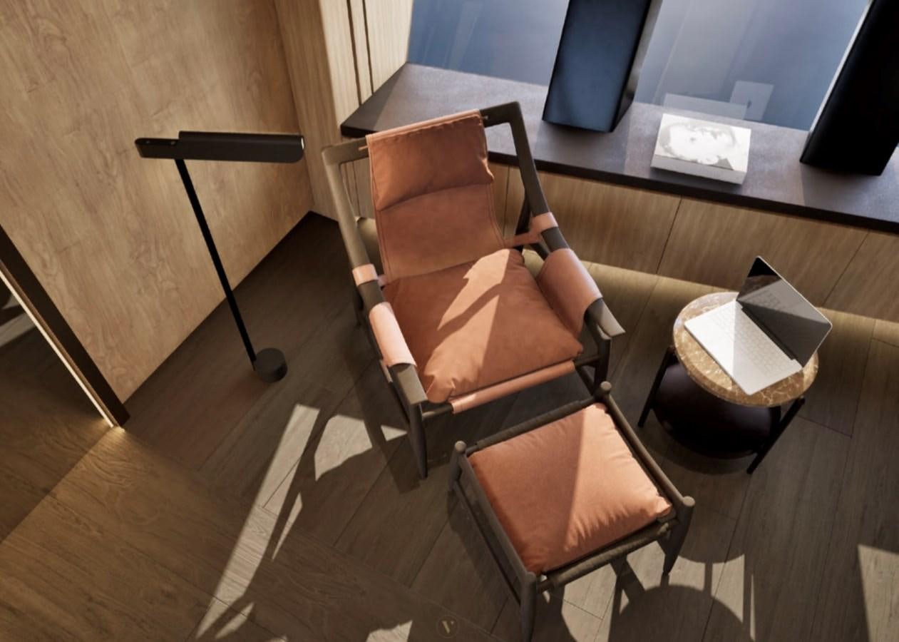 a person sitting in a chair aboard PROJECT ICE Yacht for Sale