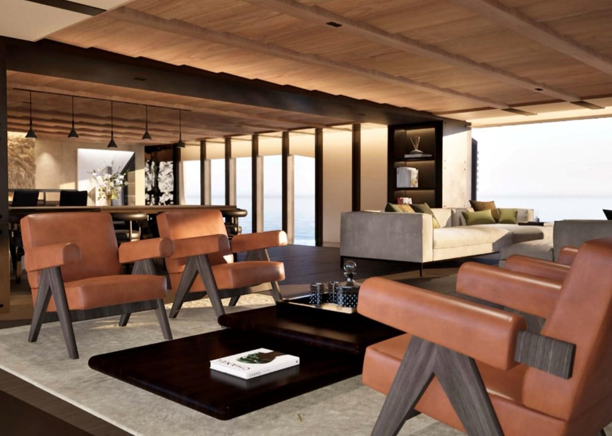 a room with a couch and a coffee table aboard PROJECT ICE Yacht for Sale