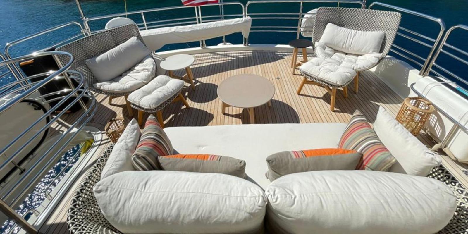 a room with chairs and tables aboard SWORDFISH 68 Yacht for Sale