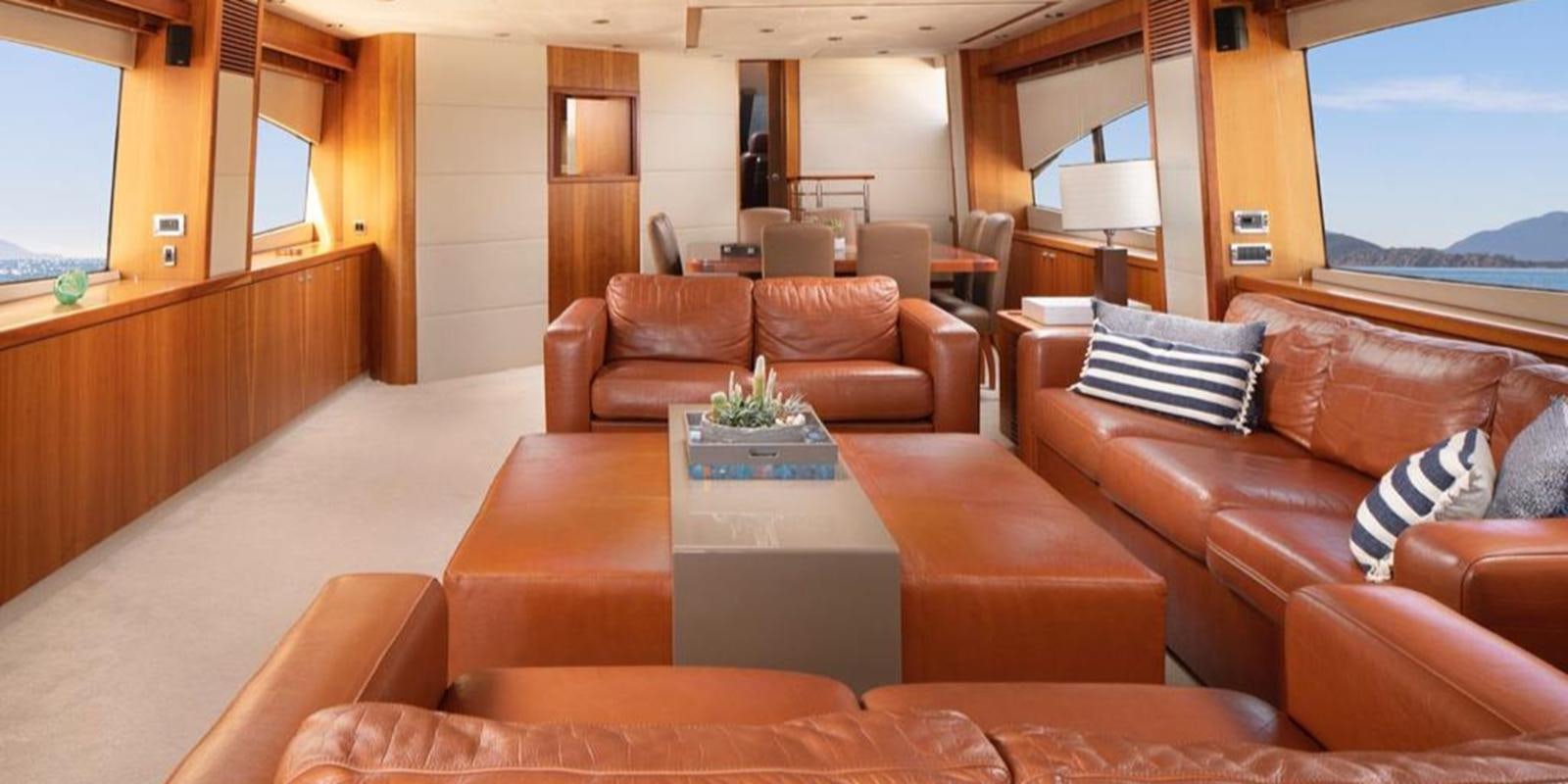 a living room with a large window aboard SWORDFISH 68 Yacht for Sale