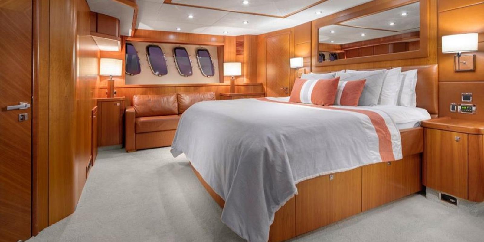 a bed in a room aboard SWORDFISH 68 Yacht for Sale