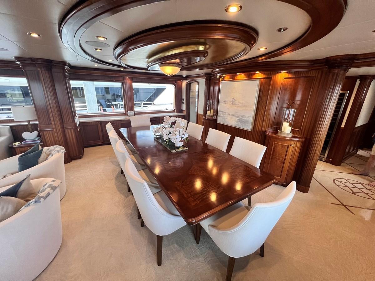 a large room with a table and chairs aboard MISS STEPHANIE Yacht for Sale