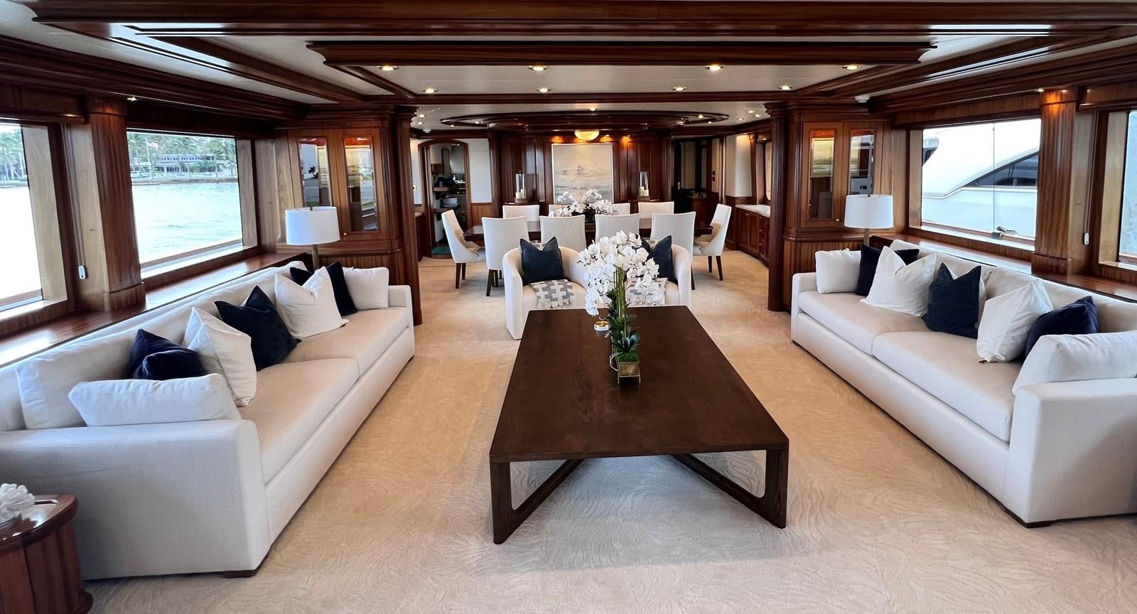 a living room with a couch and a coffee table aboard MISS STEPHANIE Yacht for Sale
