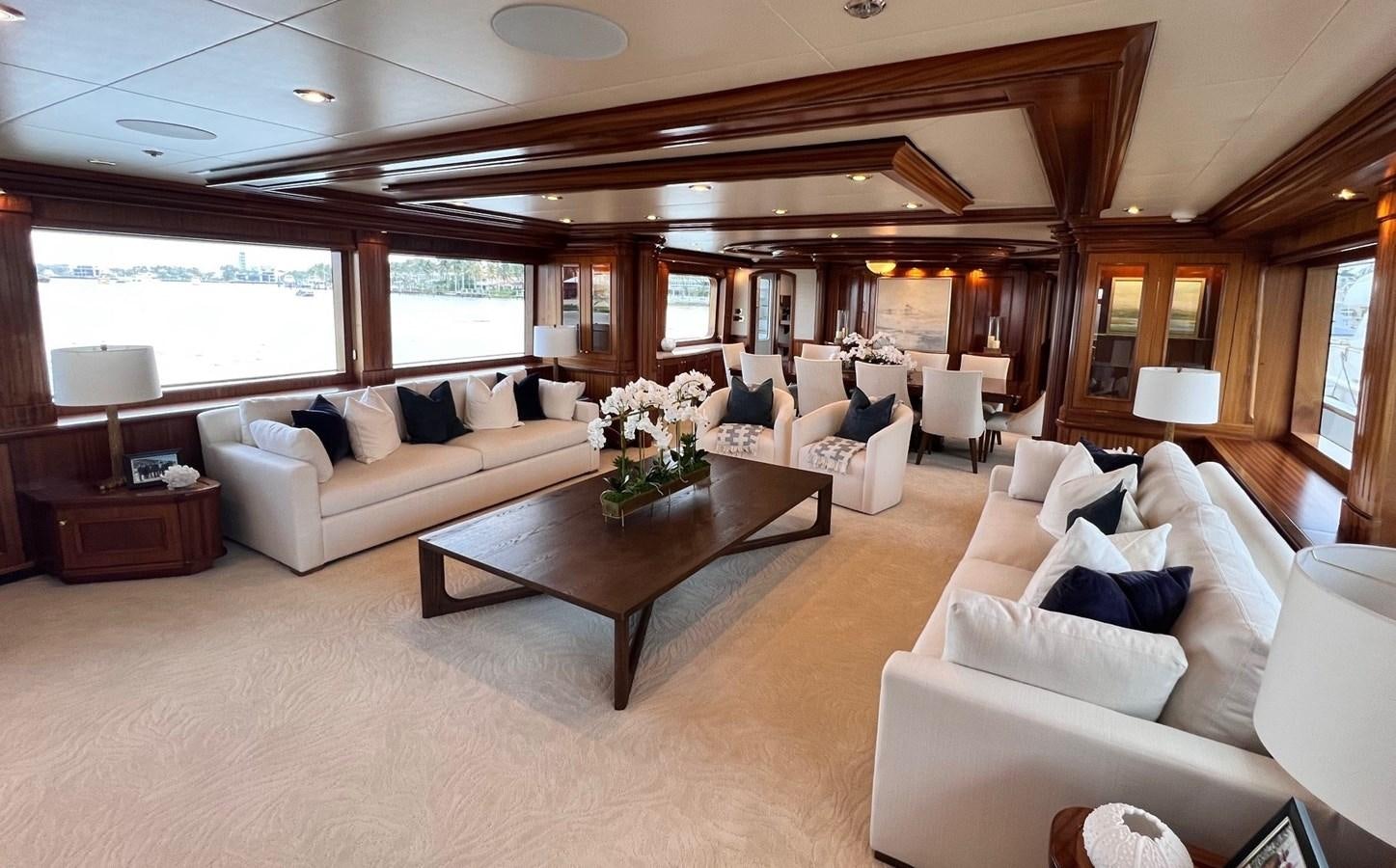 a living room with a couch and a coffee table aboard MISS STEPHANIE Yacht for Sale