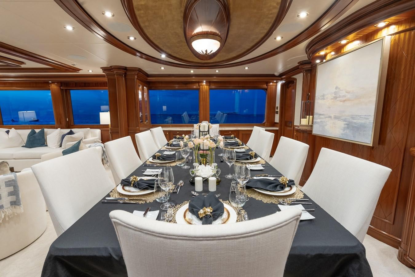 a room with tables and chairs aboard MISS STEPHANIE Yacht for Sale