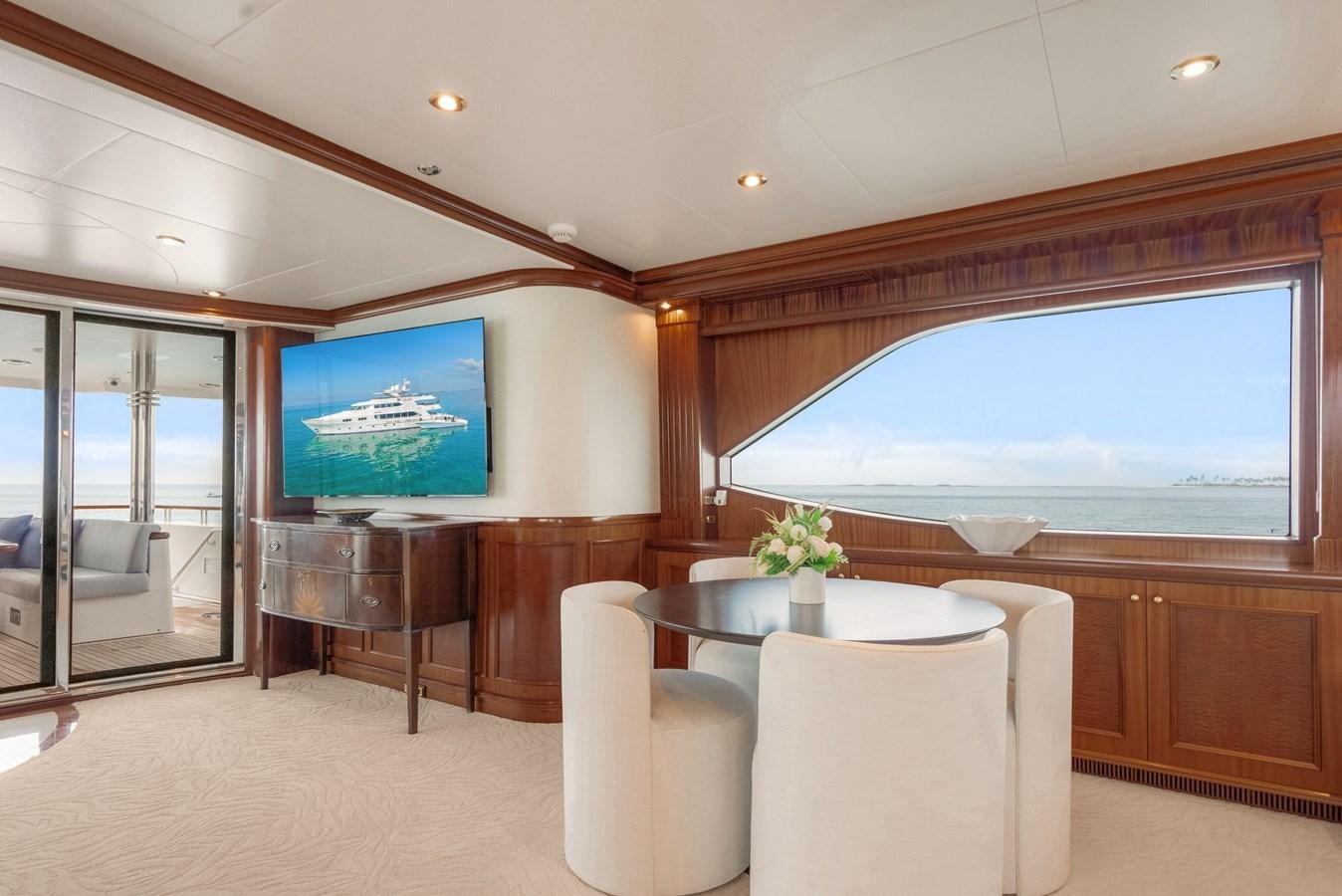 a room with a table and chairs aboard MISS STEPHANIE Yacht for Sale