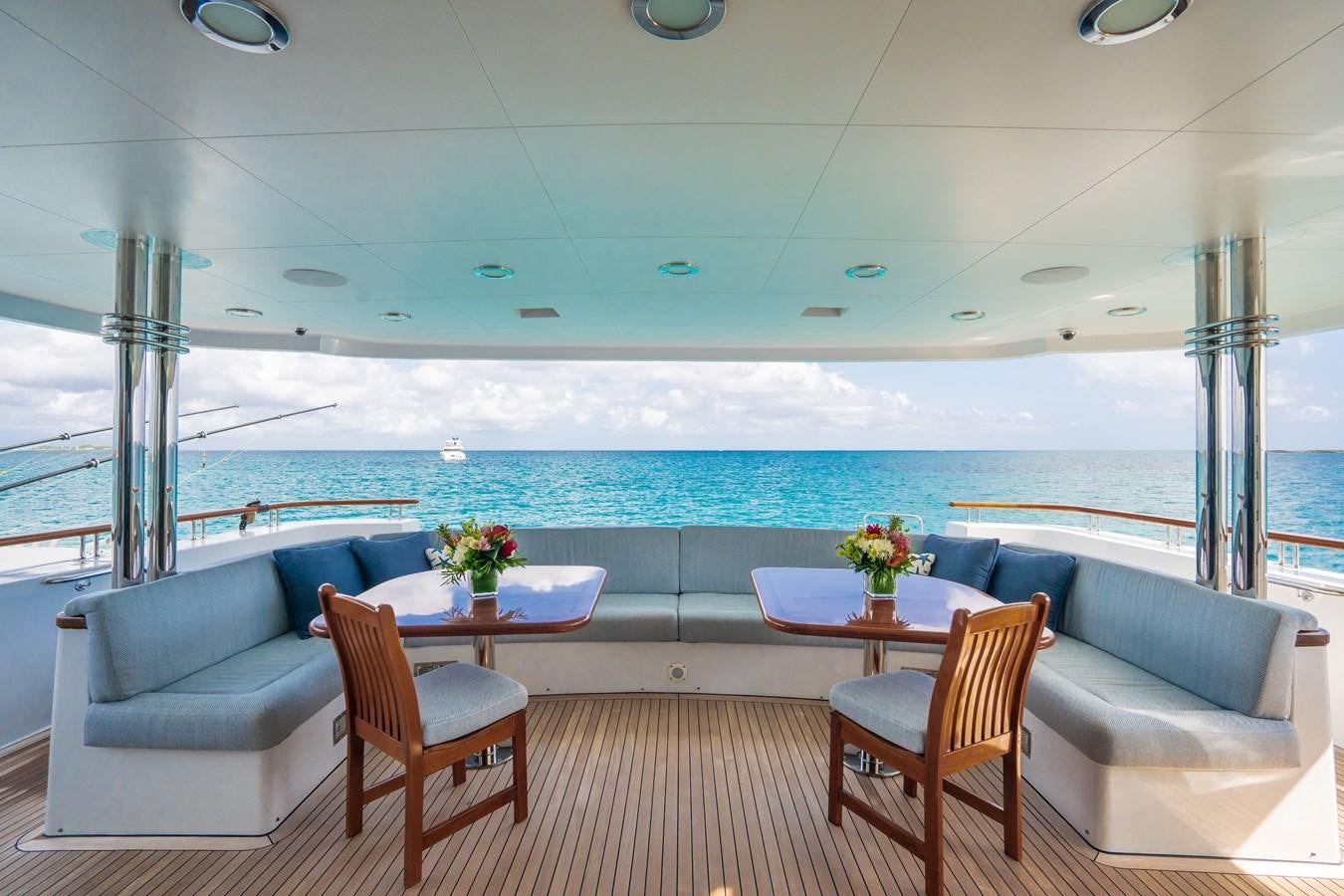a room with a table and chairs aboard MISS STEPHANIE Yacht for Sale