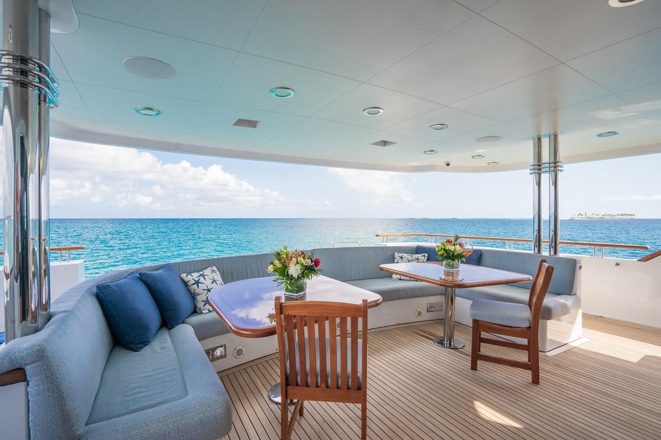 a room with a table and chairs aboard MISS STEPHANIE Yacht for Sale