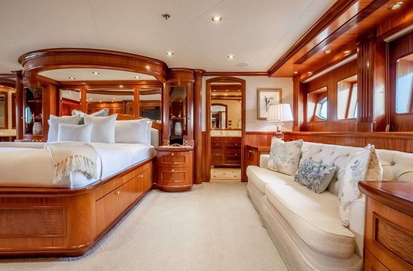 a bedroom with a bed and a couch aboard MISS STEPHANIE Yacht for Sale