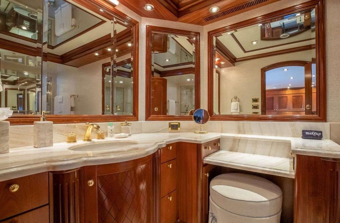 a bathroom with a large mirror aboard MISS STEPHANIE Yacht for Sale