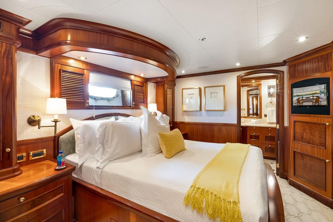 a bed with a white sheet aboard MISS STEPHANIE Yacht for Sale