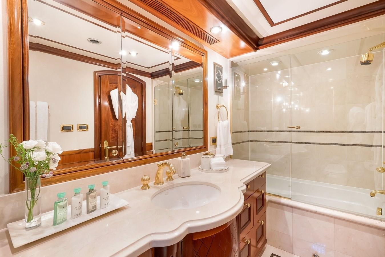 a bathroom with a large mirror aboard MISS STEPHANIE Yacht for Sale