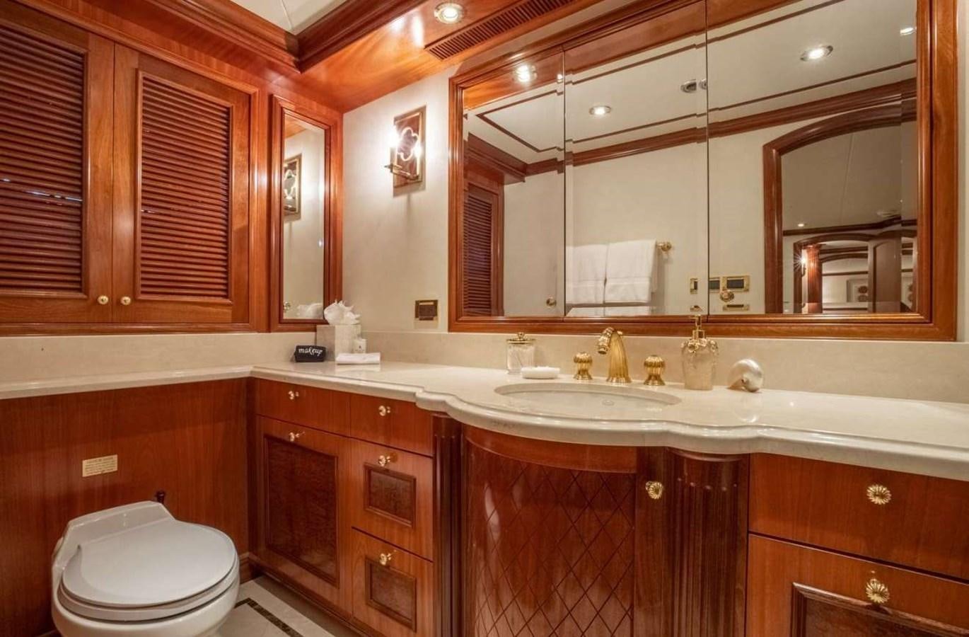 a bathroom with a toilet and a sink aboard MISS STEPHANIE Yacht for Sale