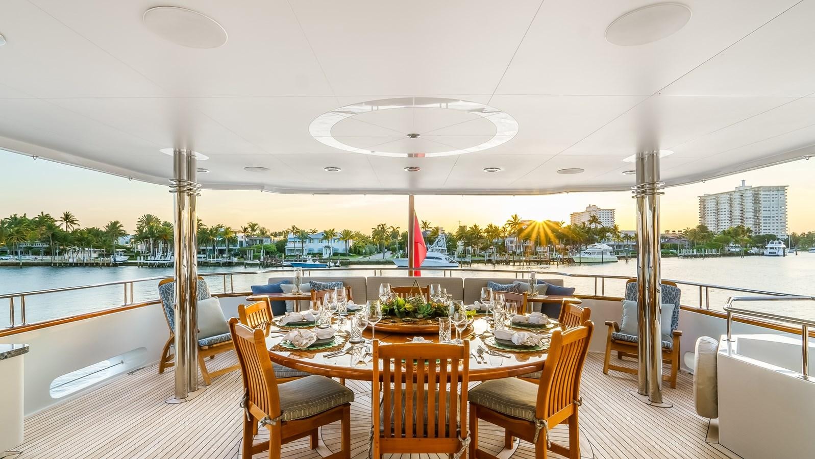 a large room with tables and chairs aboard MISS STEPHANIE Yacht for Sale