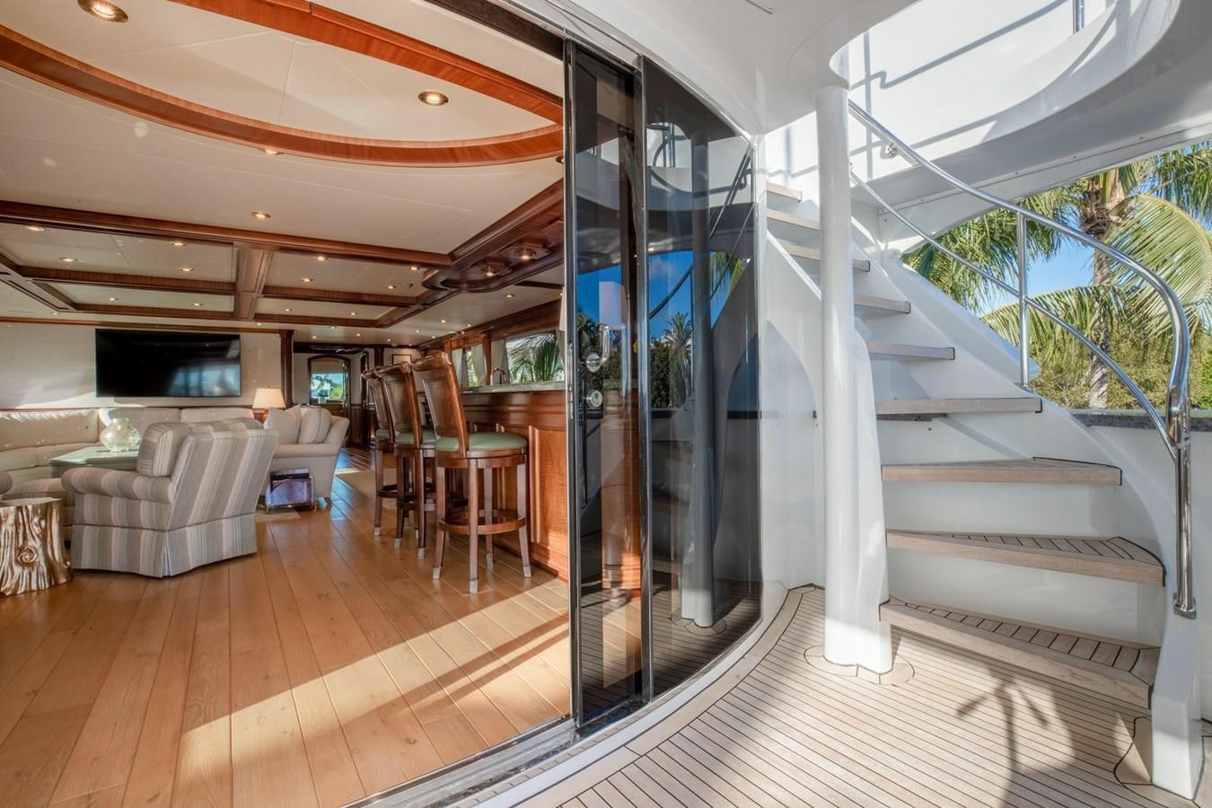a large living room with a glass wall aboard MISS STEPHANIE Yacht for Sale