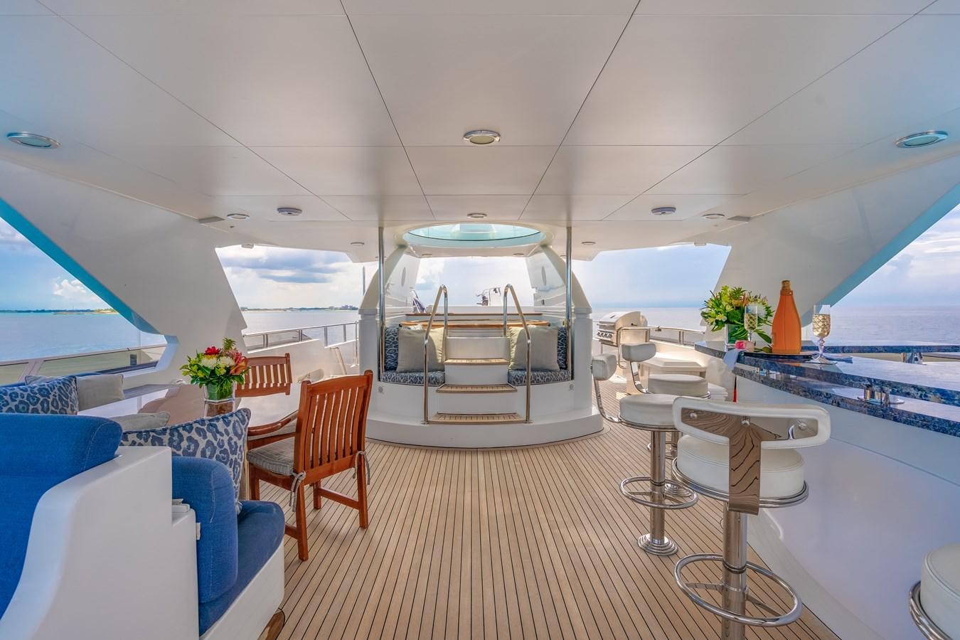 a room with tables and chairs aboard MISS STEPHANIE Yacht for Sale